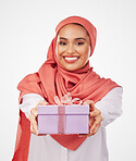 Woman, portrait and gift box, offer or prize for giveaway and shopping on a white background. Winner or muslim person in Saudi Arabia with present, ribbon package and winning or competition in studio