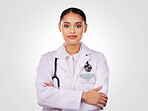 Doctor, proud and portrait of woman with arms crossed, confidence and expert in medicine and healthcare on white background. Medical worker, person and professional in studio with stethoscope 