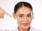 Face, woman and optometrist pointing at glasses in studio isolated on a white background. Portrait, ophthalmologist and frame of medical professional optician in lens for health in eye care vision