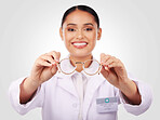 Glasses in hands, woman and portrait of optometrist in studio isolated on white background. Face smile, ophthalmologist and frame of happy medical professional optician for health in eye care vision