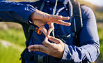 Closeup, hiking and a hand of a person in nature for fitness, training or a sign for exercise. Morning, mountain and an athlete with a gesture for travel, sports or cardio walking or trekking
