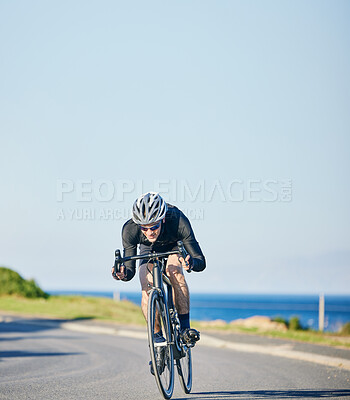 Buy stock photo Speed, fitness and cyclist on bicycle on road in mountain with blue sky, exercise adventure trail and speed. Cycling race, nature and man with bike for fast workout, training motivation or energy.