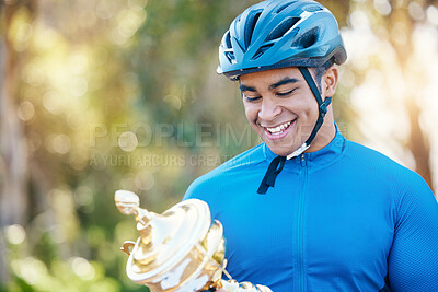 Buy stock photo Winner, trophy or happy man cyclist in celebration of victory performance or success in a race tournament. Award, motivation or proud sports athlete winning a cycling competition with smile or reward