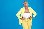Portrait, fashion and mockup with a black woman laughing on a blue background in studio for marketing. Smile, space and funny with a young confident person posing hands on hips for advertising