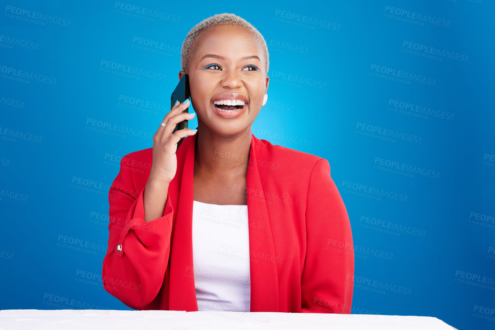 Buy stock photo Phone call, laughing and a woman in studio for communication, contact or conversation. Happy face of an African person on a blue background with a smartphone for funny chat, talking or networking