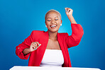 Happy, dancing and a woman in studio with fun energy for celebration, good news or fashion. Excited African person on blue background to celebrate success, positive attitude or dancer moving to music