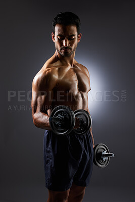 Buy stock photo Muscle, strong and studio man with dumbbell challenge results, arm workout development and body fitness progress. Dark shadow, gym equipment and sports athlete with training focus on grey background