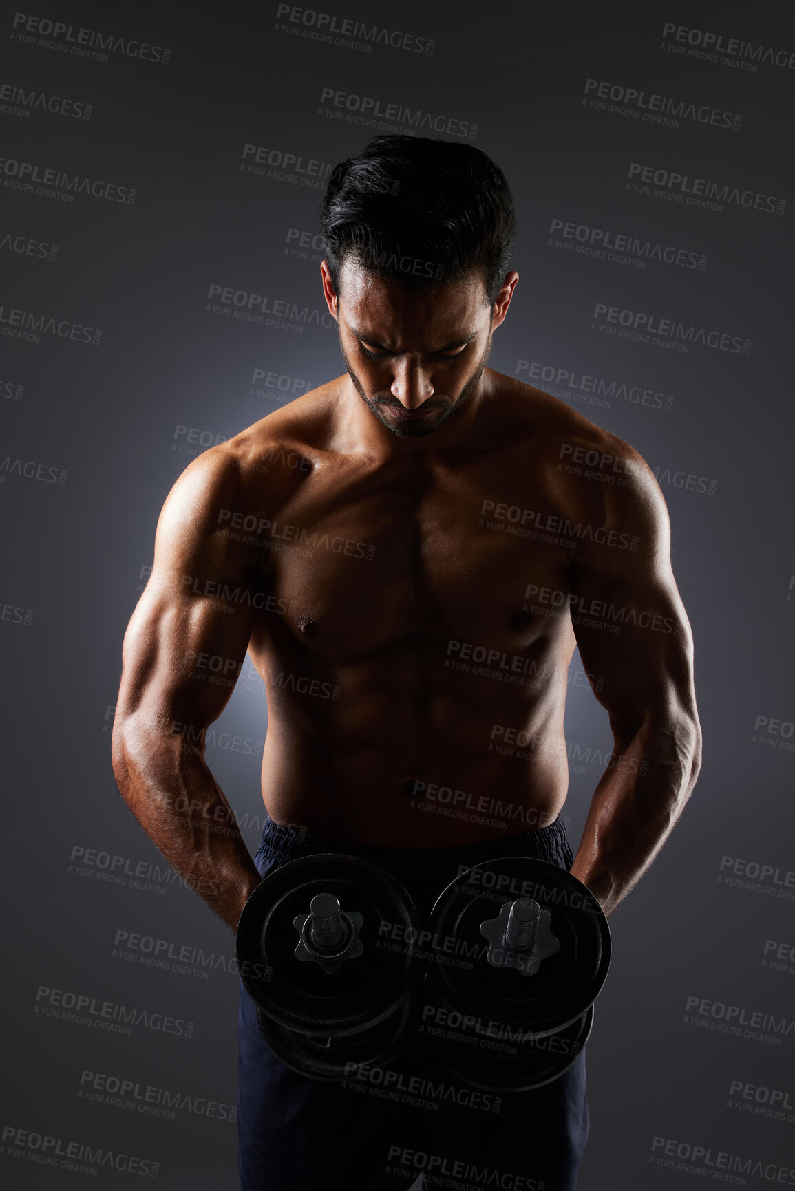 Buy stock photo Muscle, dark studio and man with dumbbell challenge, arm workout development and training determination. Bodybuilder progress, gym equipment and sports person doing weightlifting on grey background