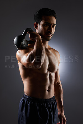 Buy stock photo Training, studio portrait and man with kettlebell challenge, workout and fitness determination, motivation or weightlifting transformation. Gym equipment, athlete focus and person on grey background