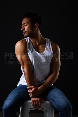 Buy stock photo Relax, muscle and sexy man on chair in studio with fitness inspiration, beauty aesthetic and sensual fashion. Erotic art, sexual body and male model on black background, thinking with dark lighting.