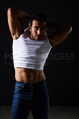 Buy stock photo Fitness, fashion and muscle with man in studio for strong, body and health. Sports, wellness and workout with person and remove tshirt on dark background for  bodybuilder, gym and athlete motivation