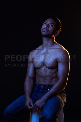 Buy stock photo Topless, sexy and man in neon studio for fitness inspiration, beauty aesthetic or sensual fantasy. Erotic art, sexual body and male model thinking with muscle, black background and dark blue lighting