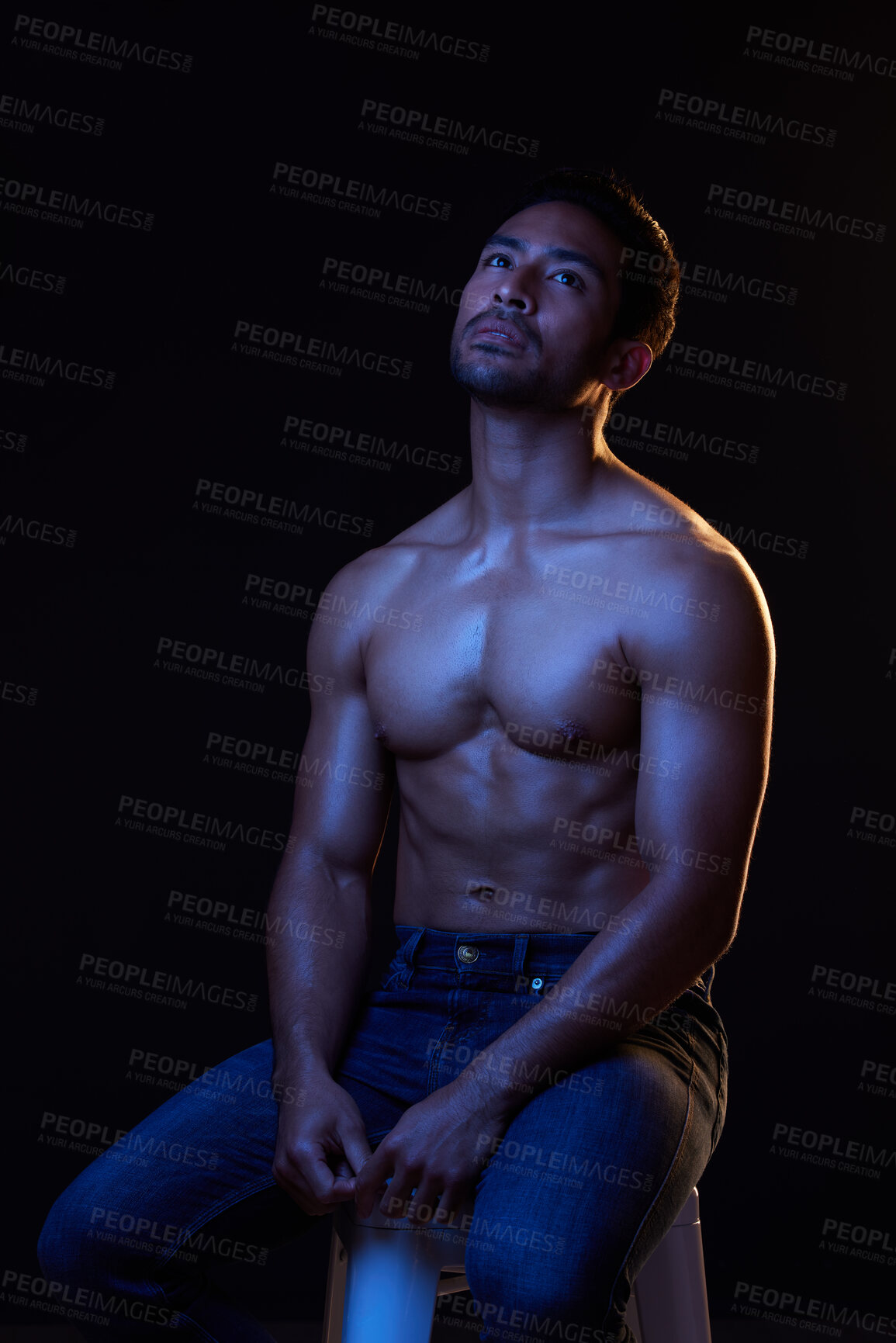 Buy stock photo Topless, sexy and man in neon studio for fitness inspiration, beauty aesthetic or sensual fantasy. Erotic art, sexual body and male model thinking with muscle, black background and dark blue lighting