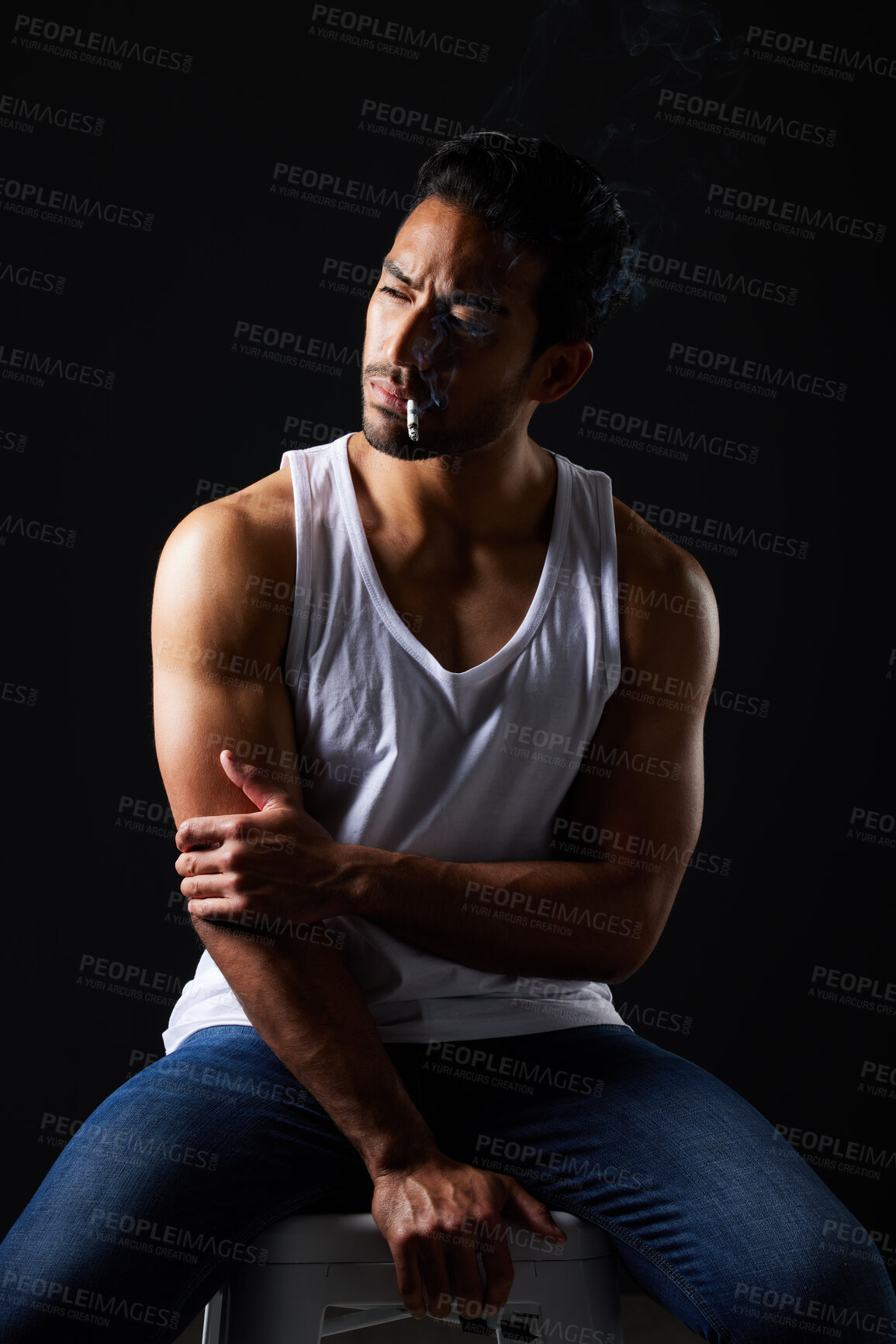 Buy stock photo Smoking, thinking and sexy man on chair in studio in fitness, beauty aesthetic and sensual fashion. Erotic art, sexual body and male model with muscle, cigarette and black background in dark lighting