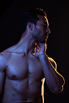 Sexy, topless and sensual man on black background in fitness inspiration, beauty aesthetic or fantasy. Erotic art, sexual body or seductive male model with muscle motivation, studio and dark lighting