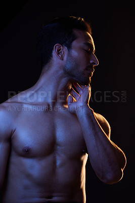 Buy stock photo Sexy, topless and sensual man on black background in fitness inspiration, beauty aesthetic or fantasy. Erotic art, sexual body or seductive male model with muscle motivation, studio and dark lighting