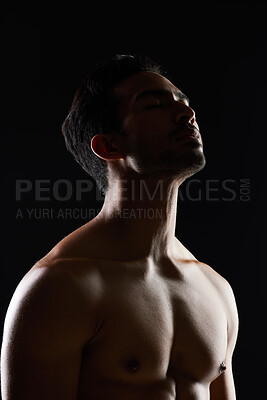 Buy stock photo Bodybuilder man, muscle and shadow in studio with wellness, healthy body and black background. Young guy, fitness and silhouette in dark, thinking and strong with ideas, health and shirtless for art