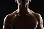 Chest, muscle and man on black background for fitness inspiration, beauty aesthetic or strong body motivation. Shadow aesthetic, male sports model or muscular bodybuilder in dark studio with lighting