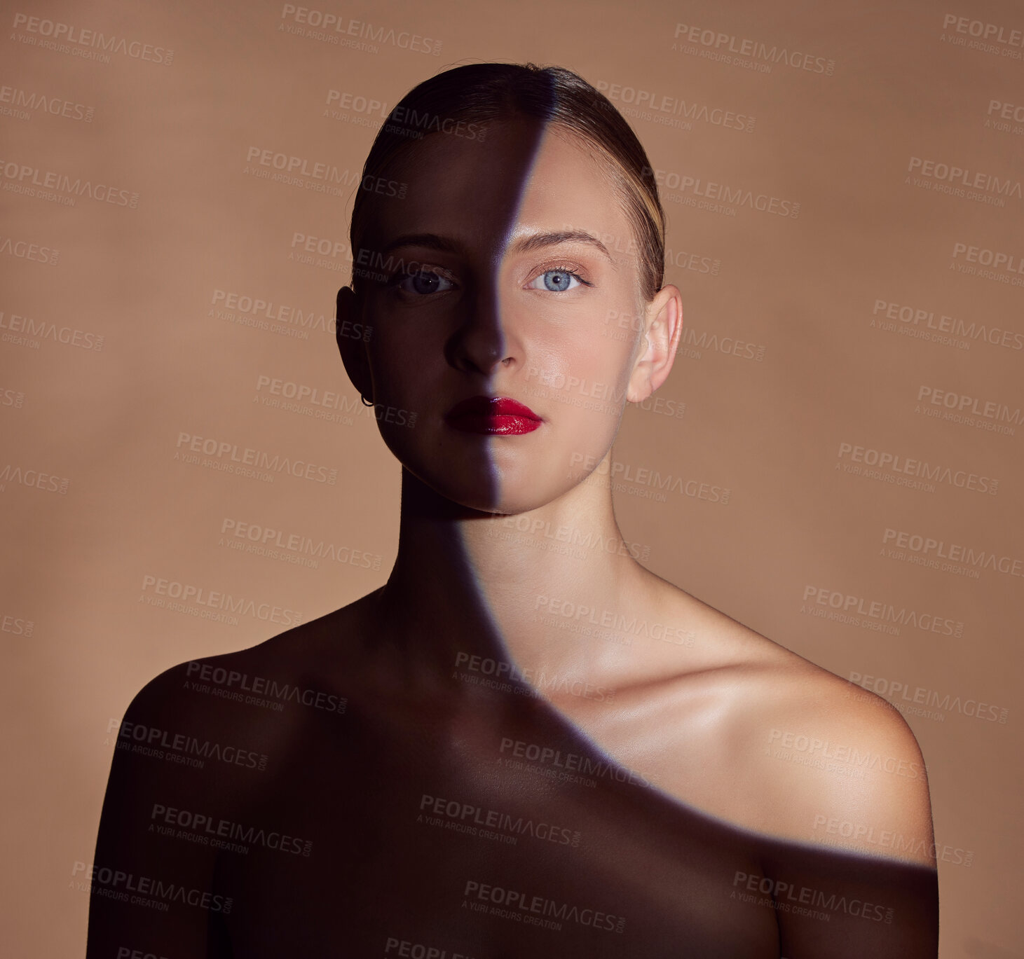 Buy stock photo Spotlight, portrait or shadow for lipstick, beauty or creative aesthetic with light on studio background. Model, face or woman with dark side or art style for skincare, makeup or facial cosmetics