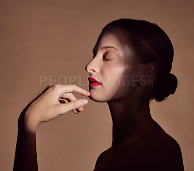 Buy stock photo Spotlight, profile or woman in shadow with beauty and creative aesthetic in studio background. Light, natural and face of model with dark side, art or style for skincare, makeup or lipstick cosmetics
