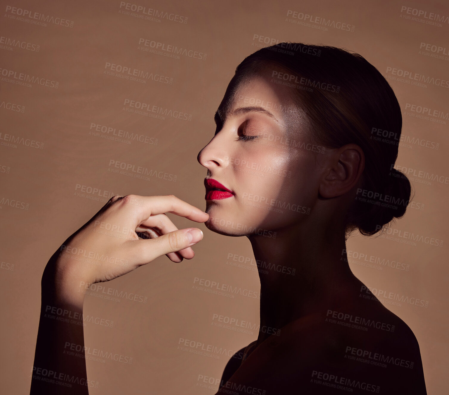 Buy stock photo Spotlight, profile or woman in shadow with beauty and creative aesthetic in studio background. Light, natural and face of model with dark side, art or style for skincare, makeup or lipstick cosmetics