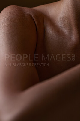 Buy stock photo Body, closeup and healthy skin of black woman, shoulder or natural glow from skincare in studio with antiaging cosmetics. Beauty, self care and arm of model with clean, hygiene and aesthetic wellness