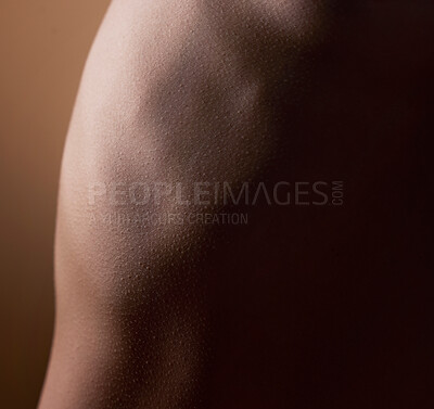 Buy stock photo Closeup, dark and back of body on a studio background for texture, creativity or skincare. Muscle, strong and a person for wellness, self care or zoom for beauty aesthetic on a backdrop for art