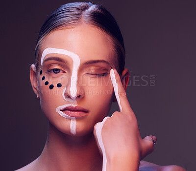 Buy stock photo Woman, skin and paint in studio, wink and closeup for art, wellness or fantasy with cosmetic by dark background. Girl, model and facial painting for eyes, creativity or pattern with makeup for change
