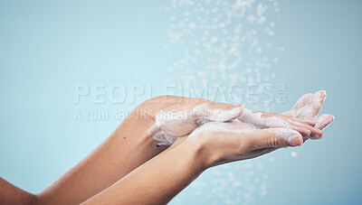Buy stock photo Cleaning, hands and woman with soap and water in studio, blue background and healthcare or skincare mockup. Model, closeup or washing skin for clean, hygiene and protection from bacteria or virus