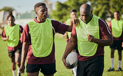 Buy stock photo Sports, fitness and men for rugby training, workout and exercise on grass field for competition. Teamwork, collaboration and athletes with ball for support in practice, match and game for challenge