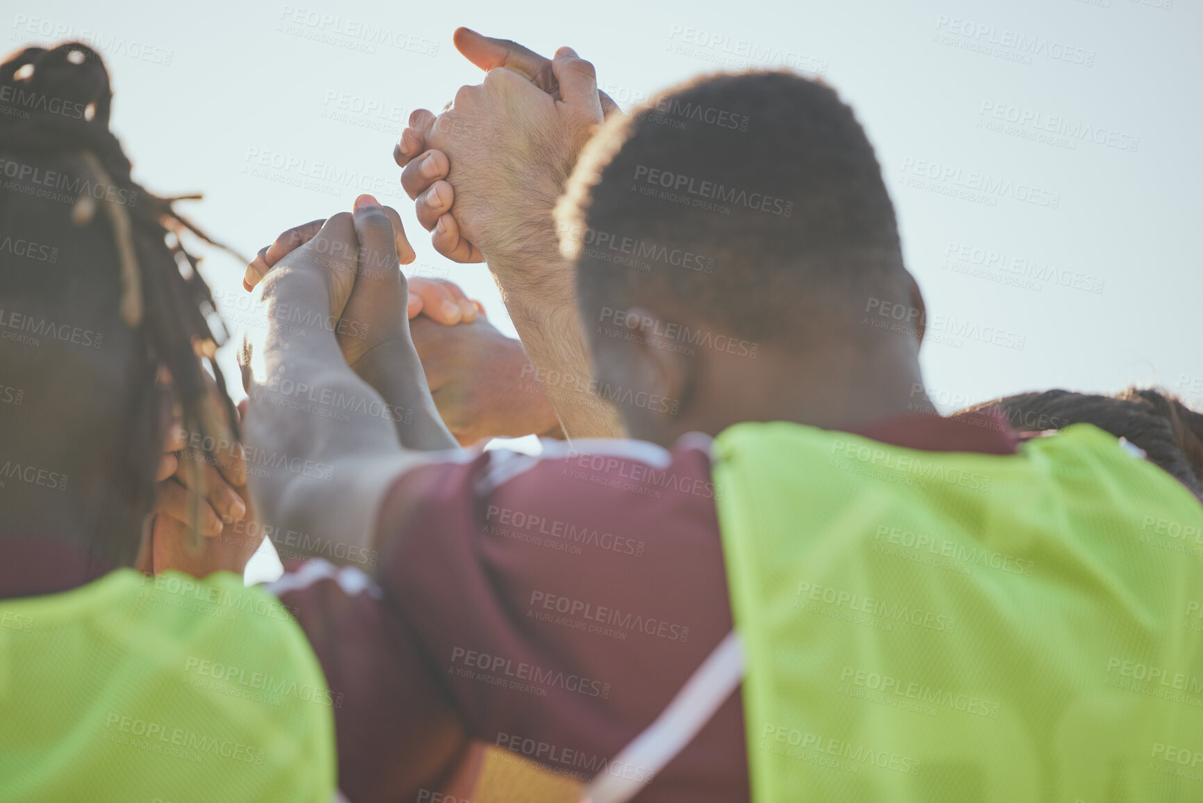 Buy stock photo Football, teamwork and men holding hands, fitness and cooperation with collaboration, training and exercise. People, group and players with support, soccer and workout with practice and motivation