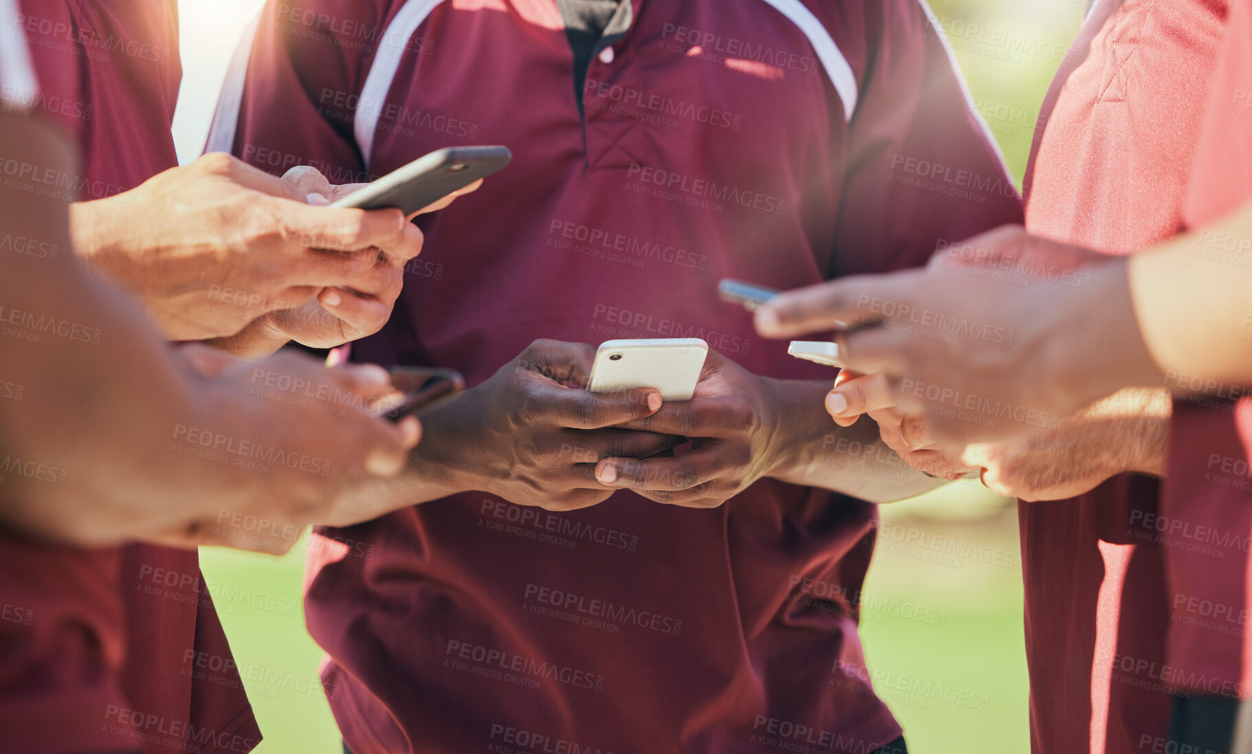 Buy stock photo Sports, group and phone with hands of people on field for networking, teamwork and social media. Contact, fitness and health with closeup of friends in stadium for internet, communication and app