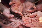 Hands, palm and diversity of people in circle for charity, ngo and support in poor community together from above. Helping hand, donation and empathy for children in poverty, society and crowdfunding