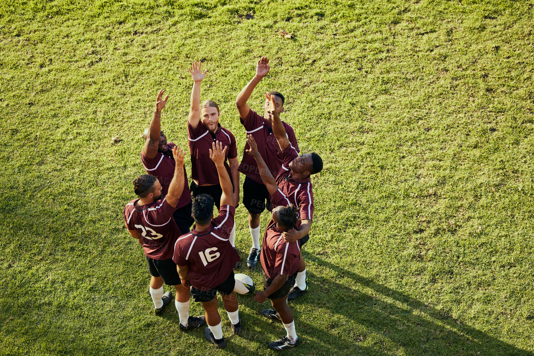 Buy stock photo Raised hand, sports and rugby people celebrate teamwork, team building or winning game, match or tournament competition. Success motivation, top view winner and circle of men happy, excited or cheers