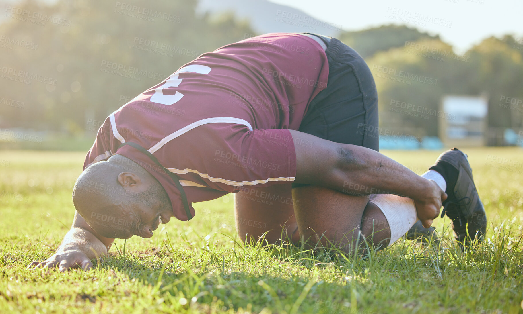 Buy stock photo Injury, leg pain and black man, sports athlete or rugby player with joint fatigue from accident, training workout or exercise. Game, body burnout and African person sore, hurt and broken bone risk