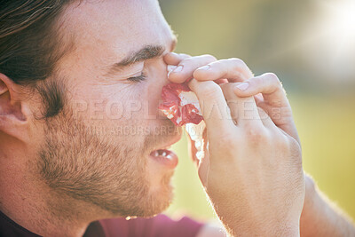 Buy stock photo Nose bleed, man and injury closeup on sport field with emergency, accident and blood outdoor. Swollen, broken and male athlete with medical and bruise after pain, game workout and exercise training