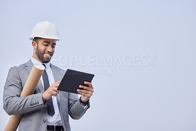 Buy stock photo Happy man, architect and tablet on mockup in construction planning on a studio background. Person, engineer or contractor smile with technology and blueprint in project or architecture plan on space