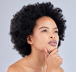 Thinking, serious and a black woman on a studio background for skincare, dermatology or health idea. Makeup, cosmetics and an african model or person with vision for a glow or wellness with a plan