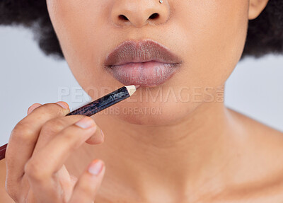 Buy stock photo Makeup, beauty and lips of woman with pencil in studio for wellness, skincare product and cosmetics. Salon, aesthetic and face zoom of person with lipstick or lip liner for glamour, makeover and glow