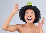 Apple balance, black woman and health with diet and natural skincare glow in studio. Happy, excited and fruit for healthy nutrition, grey background and wellness with a smile from organic food