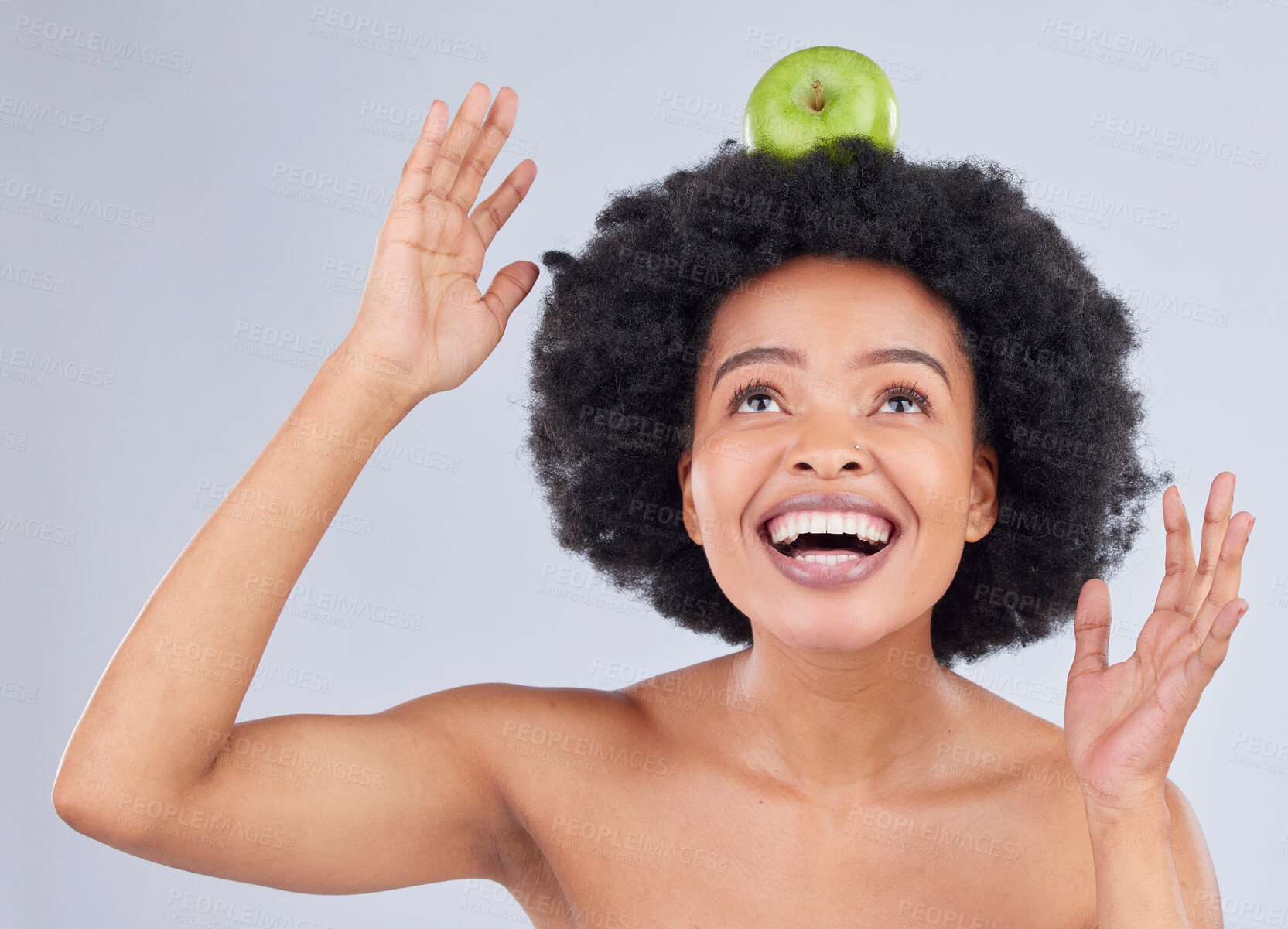 Buy stock photo Apple balance, black woman and health with diet and natural skincare glow in studio. Happy, excited and fruit for healthy nutrition, grey background and wellness with a smile from organic food