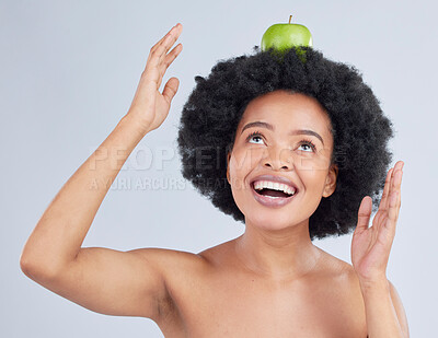 Buy stock photo Apple, balance and black woman with health, organic and diet for wellness and healthy in studio. Excited, smile and happy model with green fruit, skin nutrition and vegan food with grey background