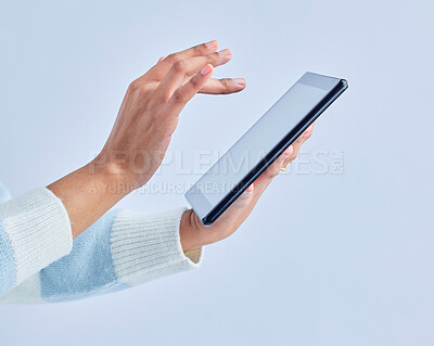 Buy stock photo Hands, tablet and person on studio for social media, reading ebook and search website on gray background. Closeup, model and digital technology for connection, download and scroll online shopping app