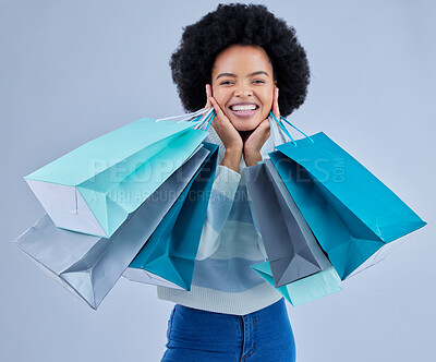 Buy stock photo Portrait, woman and shopping bag on studio background for fashion, happy retail deal and financial freedom. Excited african customer, gift and discount present from boutique, store or sales promotion