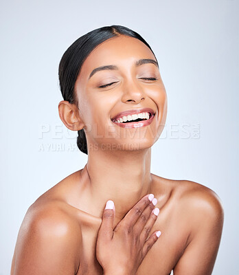 Buy stock photo Face, skincare and smile with a woman laughing for health, wellness or dermatology in studio on white background. Skincare. funny and a happy young model feeling satisfaction at her cosmetic routine