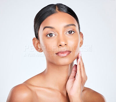 Buy stock photo Studio portrait of Indian woman for dermatology, beauty and cosmetics on white background for salon aesthetic. Skincare, spa and serious face of isolated person for wellness, glamour and facial glow