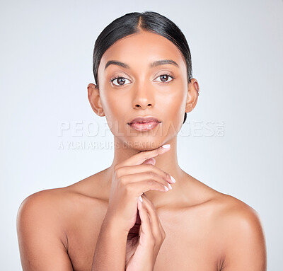 Buy stock photo Studio portrait of Indian woman for skincare, beauty and cosmetics on white background for salon aesthetic. Dermatology, spa and serious face of isolated person for wellness, glamour and facial glow