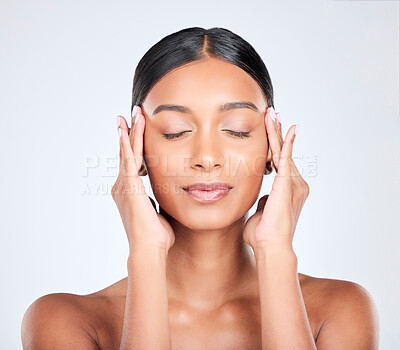 Buy stock photo Woman, face massage and beauty with skincare, dermatology and facial treatment in studio. Eyes closed, female model and wellness with soft, skin cosmetics and glow from makeup with white background
