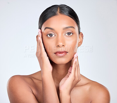 Buy stock photo Beauty, portrait and Indian woman in studio for skincare, facial and cosmetics on white background. Dermatology, salon and face touch of isolated person for wellness, satisfaction and facial care