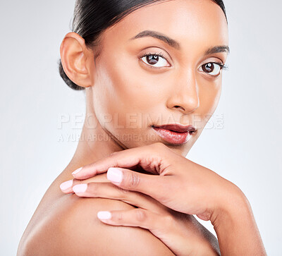 Buy stock photo Face, natural beauty and woman in a studio with cosmetics, self care and clean makeup isolated on white background. Wellness, dermatology and skincare portrait, Indian model with skin glow and shine